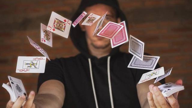 Magician playing with decks of cards